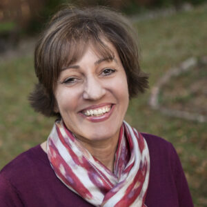 Headshot of Gail Barnes, a white female with medium dark hair.