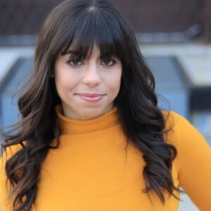 Headshot of Elizabeth Byland, a woman with light skin and long dark hair.