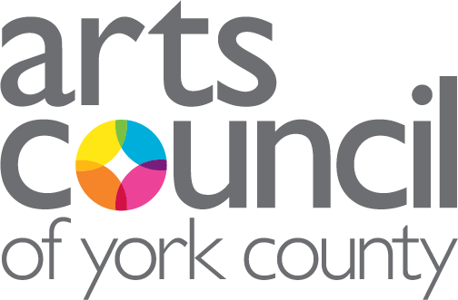 Logo for the Arts County of York County. Gray text with a color wheel in place of the "o" in "council."