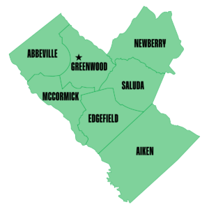 Green map showing South Carolina counties of Abbeville, Aiken, Edgefield, Greenwood, McCormick, Newberry, and Saluda, with a star in Greenwood County.